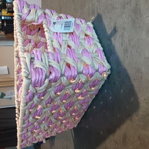 Pink and tan storage basket